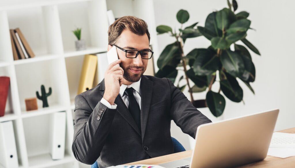 A businessman working on SaaS integration in his office.